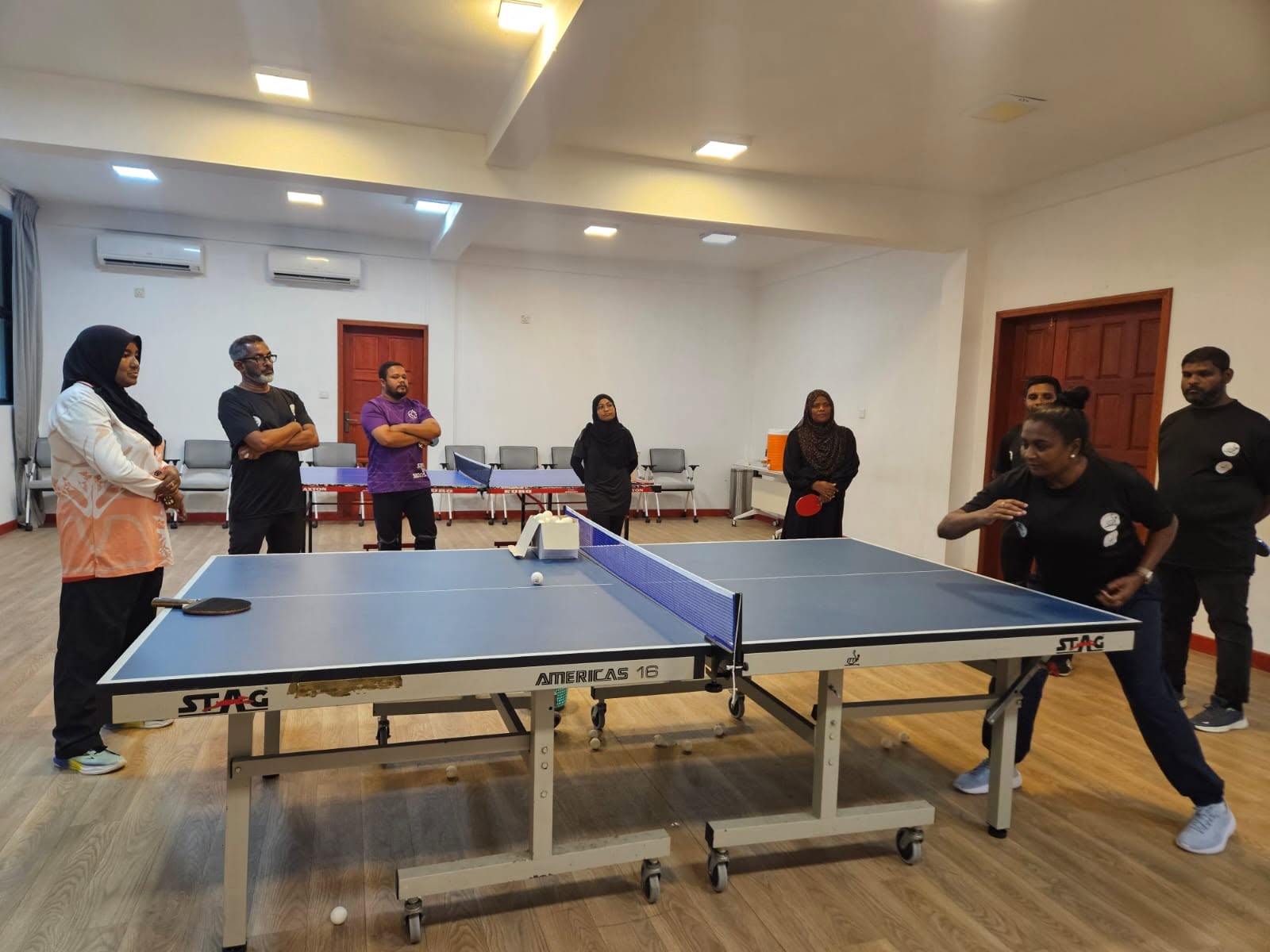 Participants watch a table tennis demonstration at the ITTF MGMS camp in Kulhudhuffushi.