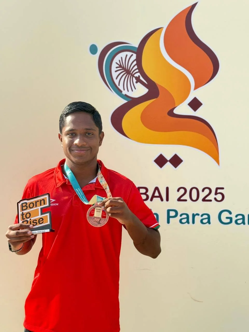 Mohamed Rizhan with his medal at Dubai 2025.